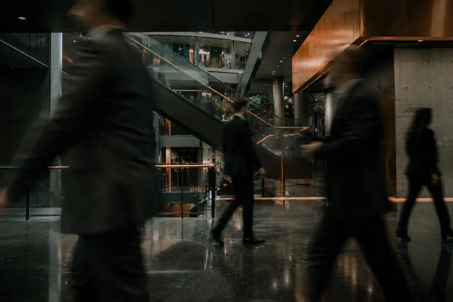 People moving through a modern office atrium